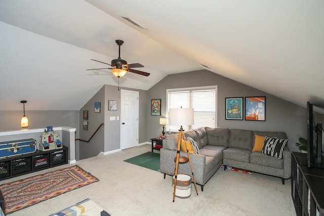 carpeted living area with a ceiling fan, lofted ceiling, visible vents, and baseboards