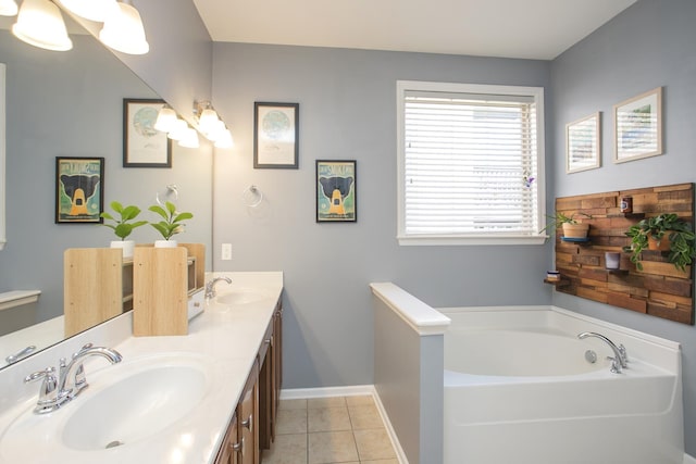 bathroom featuring a garden tub, double vanity, tile patterned flooring, and a sink