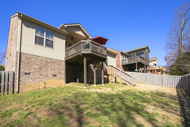 rear view of house with a ceiling fan, a fenced backyard, stairway, a deck, and brick siding