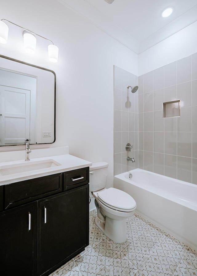 bathroom featuring tile patterned flooring, tub / shower combination, vanity, and toilet