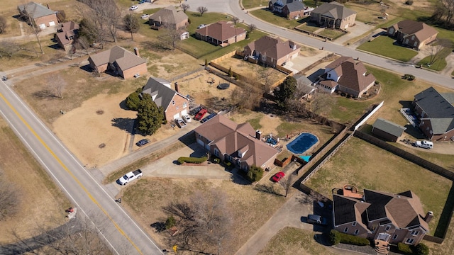 birds eye view of property with a residential view