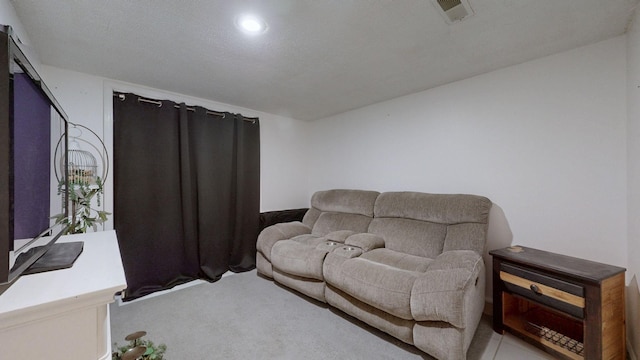 carpeted living room featuring visible vents