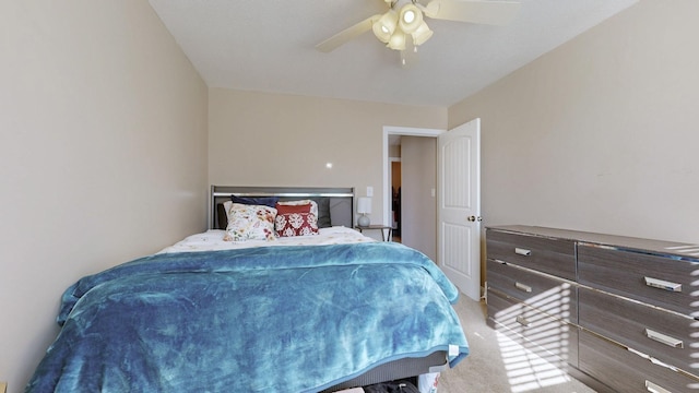 bedroom featuring a ceiling fan and light colored carpet