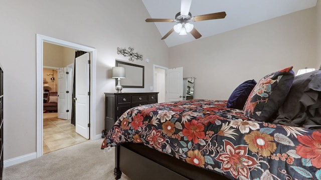 carpeted bedroom with high vaulted ceiling, baseboards, and a ceiling fan