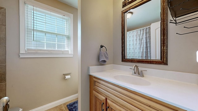 bathroom with baseboards, a shower with curtain, vanity, and tile patterned floors