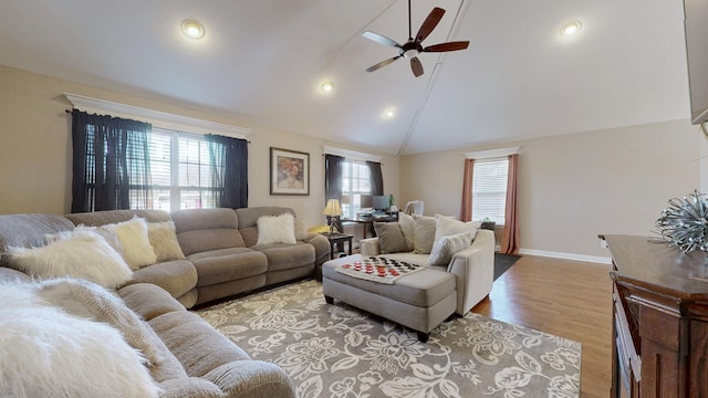 living room with baseboards, ceiling fan, wood finished floors, high vaulted ceiling, and recessed lighting