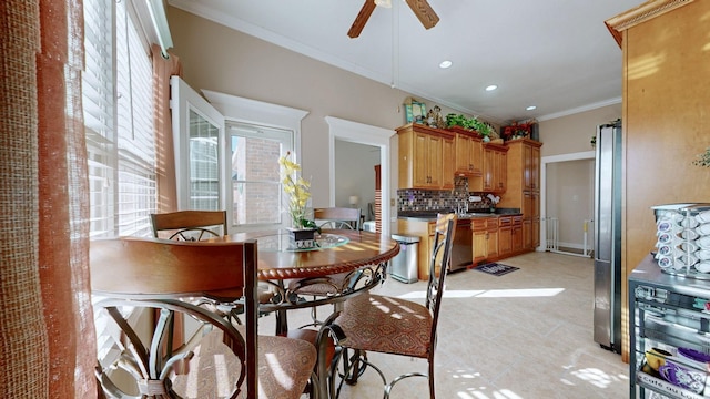 dining room with recessed lighting, a ceiling fan, and crown molding