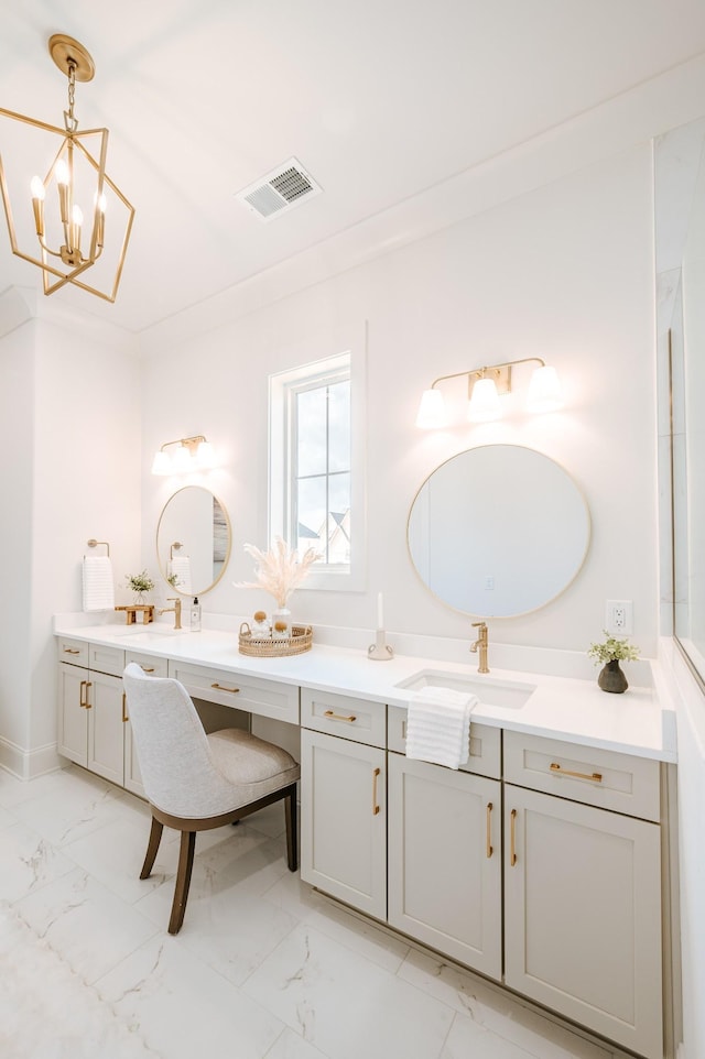 bathroom featuring marble finish floor, visible vents, and vanity