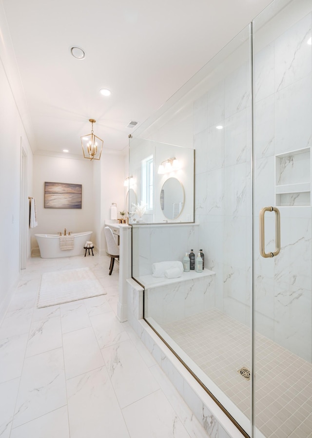 full bathroom with ornamental molding, marble finish floor, a freestanding tub, and a marble finish shower