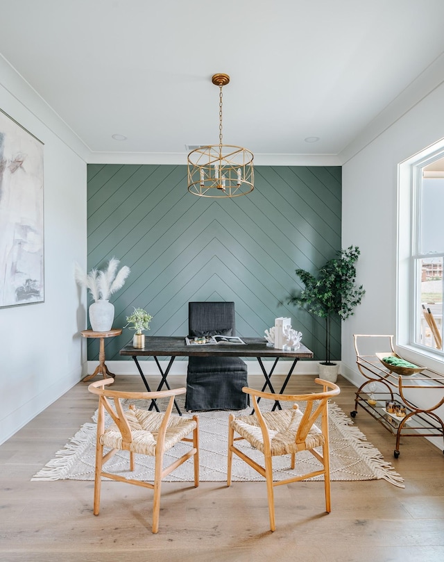 office area with a chandelier, ornamental molding, wood finished floors, and baseboards