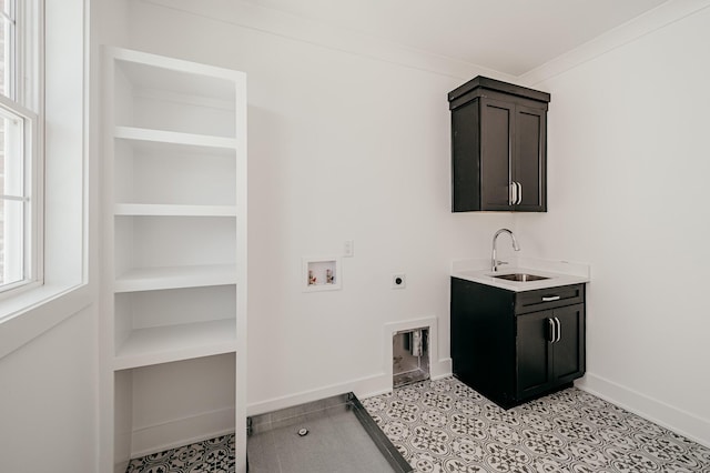 laundry area with built in features, washer hookup, a sink, electric dryer hookup, and baseboards