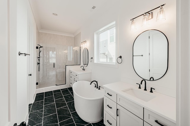 bathroom with two vanities, visible vents, a freestanding bath, a stall shower, and a sink