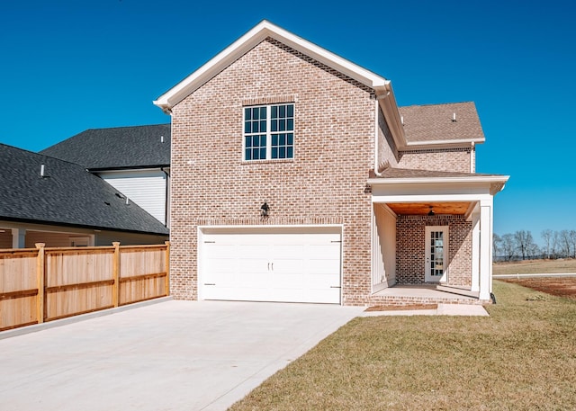 view of front of property featuring an attached garage, brick siding, fence, concrete driveway, and a front yard