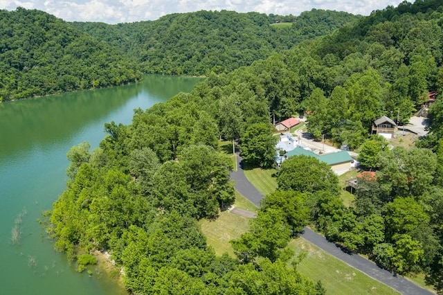 aerial view featuring a water view and a wooded view