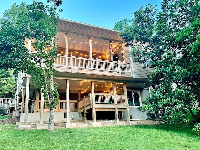 rear view of property with a yard