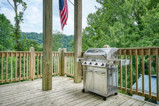 wooden deck featuring grilling area