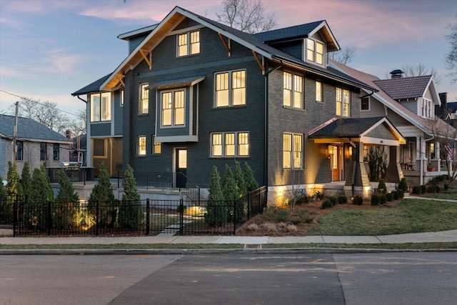 view of front facade featuring a fenced front yard and brick siding