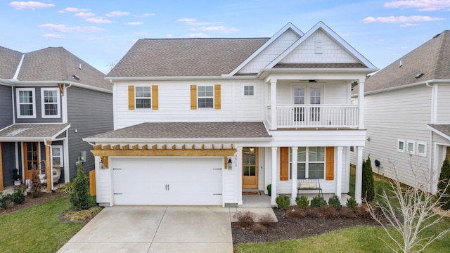 view of front of house featuring concrete driveway, a porch, a shingled roof, and a balcony