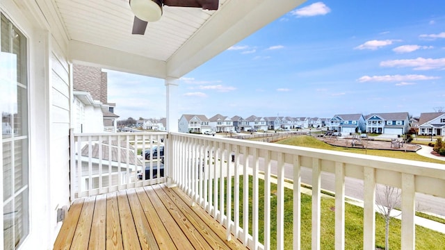 balcony with a ceiling fan and a residential view