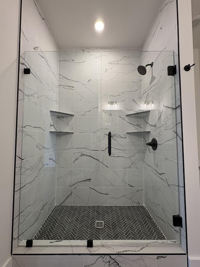 bathroom featuring a shower stall