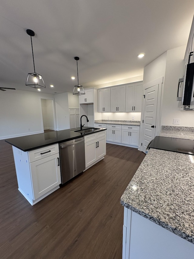 kitchen with dark wood-style flooring, hanging light fixtures, white cabinetry, a sink, and dishwasher