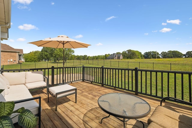 wooden terrace featuring a fenced backyard, a yard, and an outdoor hangout area