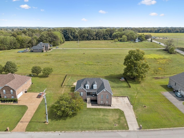 birds eye view of property with a rural view