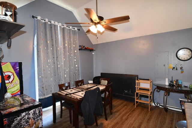 dining area with ceiling fan, vaulted ceiling, and wood finished floors