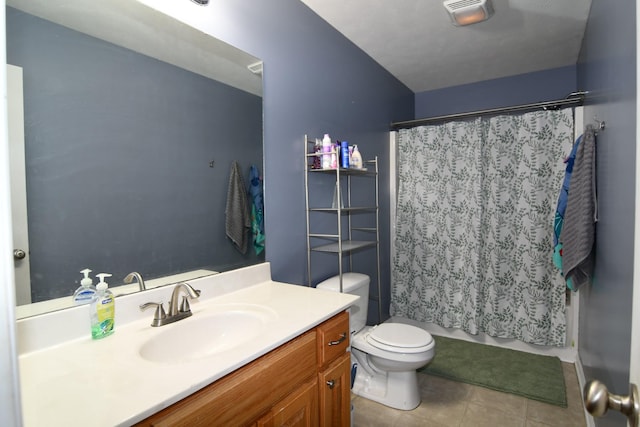 bathroom featuring toilet, vanity, tile patterned flooring, and visible vents