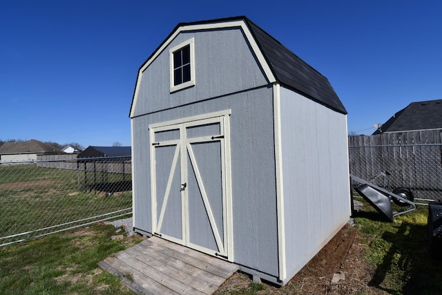 view of shed with a fenced backyard