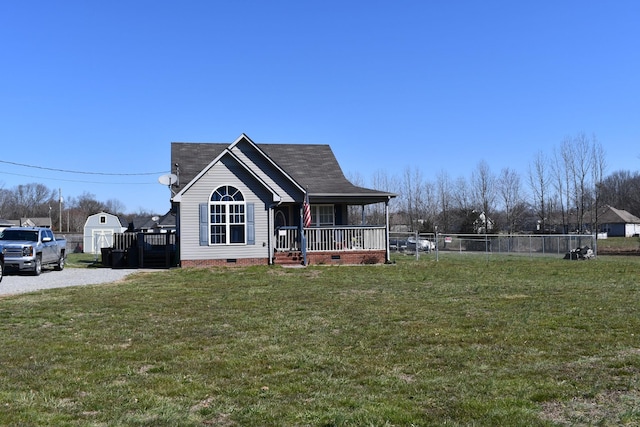 view of front facade with crawl space, fence, a porch, and a front yard