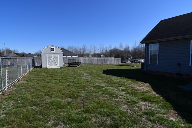 view of yard featuring a fenced backyard, an outdoor structure, and a shed