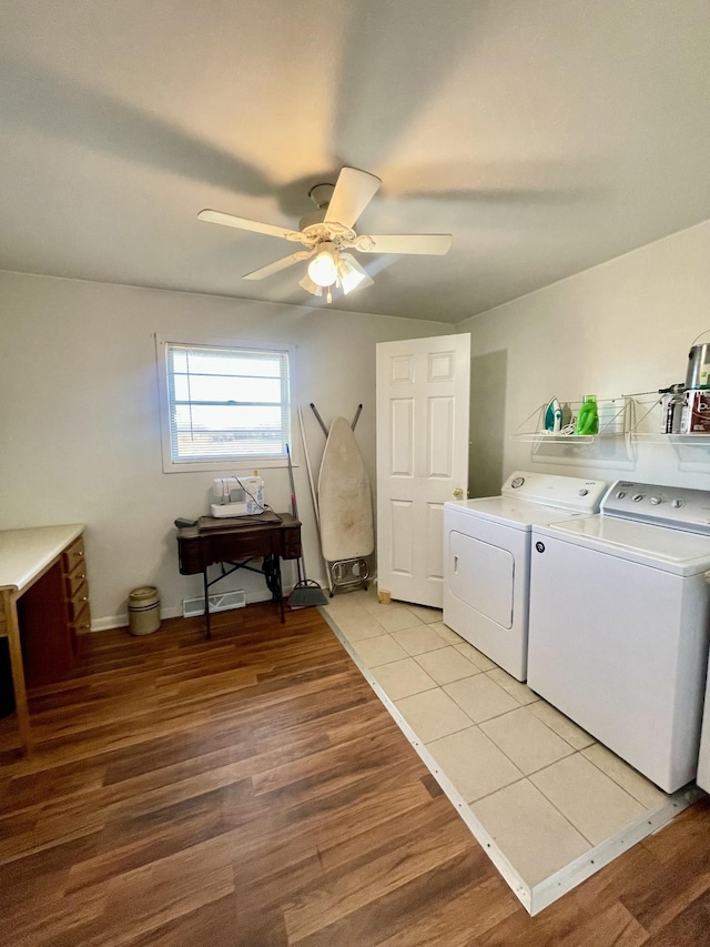 laundry area featuring washer and dryer, visible vents, a ceiling fan, light wood-type flooring, and laundry area