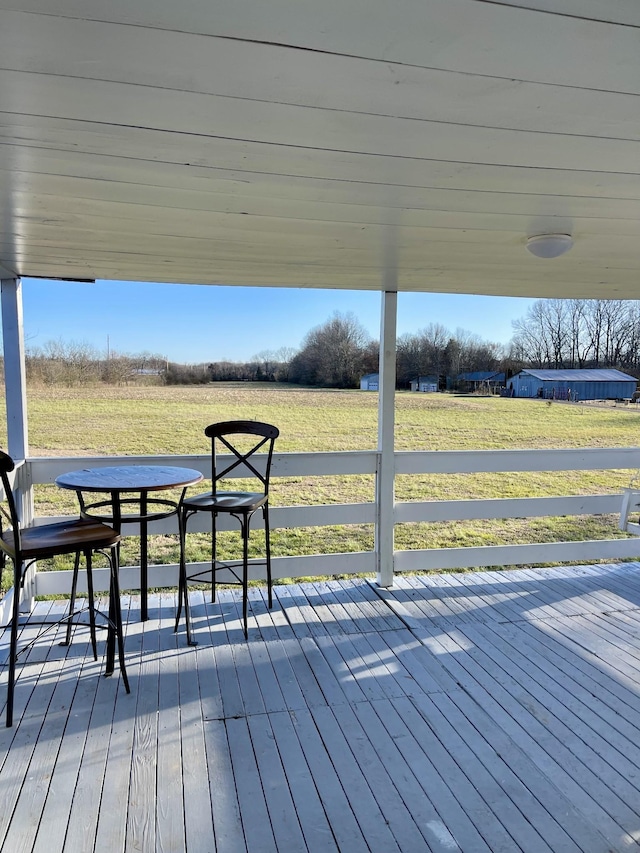 wooden deck featuring a yard