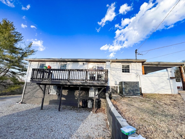 back of house featuring a deck and central AC