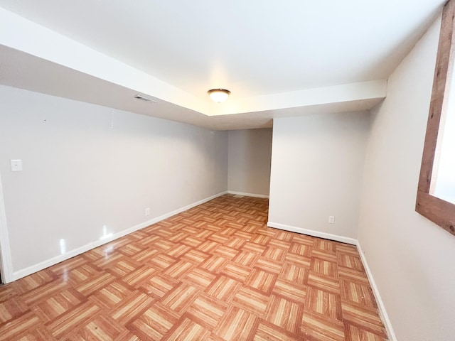 empty room with visible vents and baseboards