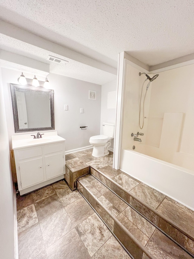 full bathroom featuring visible vents, a textured ceiling, vanity, and toilet