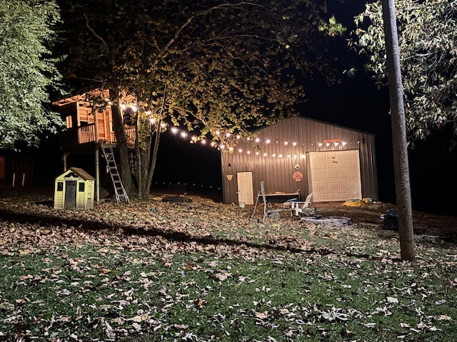 view of outbuilding with a garage and an outdoor structure