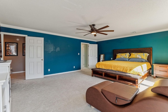 bedroom featuring carpet floors, crown molding, and baseboards