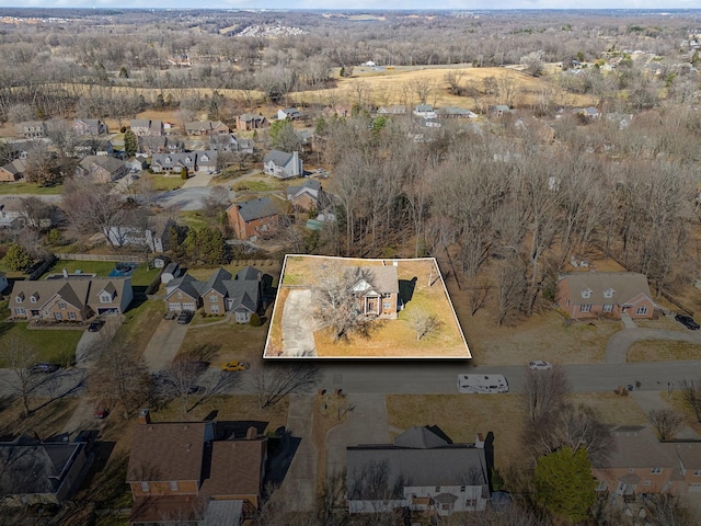 aerial view featuring a residential view and a view of trees