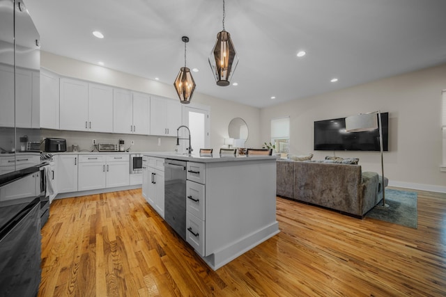 kitchen featuring light wood-type flooring, white cabinetry, and dishwasher