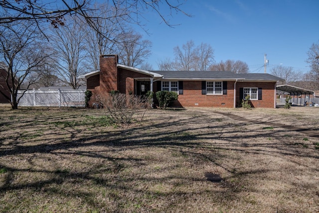 view of front of house with brick siding, fence, crawl space, a front lawn, and a chimney