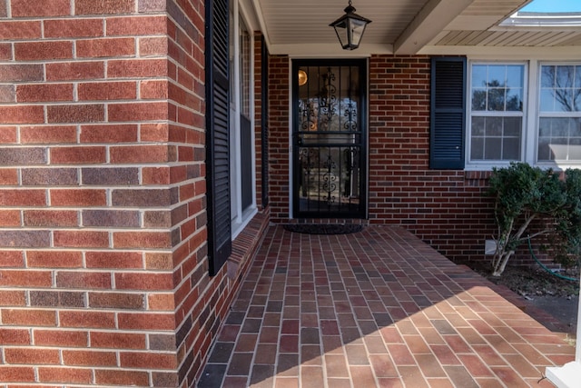 entrance to property with brick siding