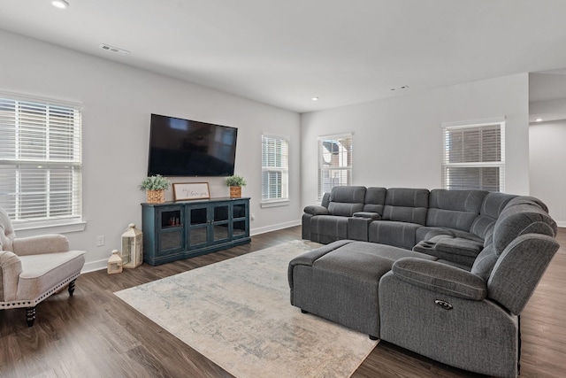 living room with visible vents, baseboards, dark wood-style flooring, and recessed lighting