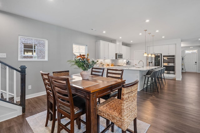 dining space featuring recessed lighting, dark wood-type flooring, visible vents, baseboards, and stairs