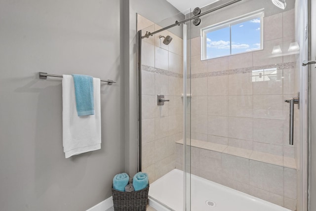 bathroom with a shower stall