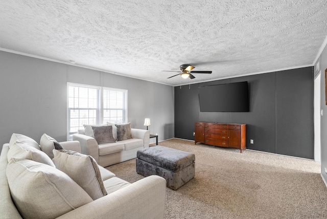 living room featuring carpet floors, ceiling fan, ornamental molding, and a textured ceiling