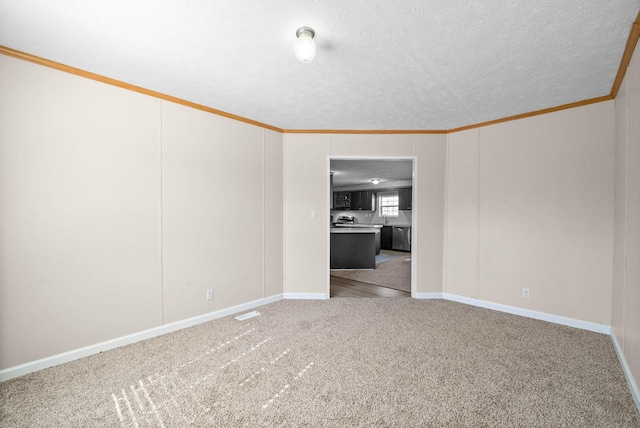 spare room featuring baseboards, visible vents, crown molding, a textured ceiling, and carpet flooring