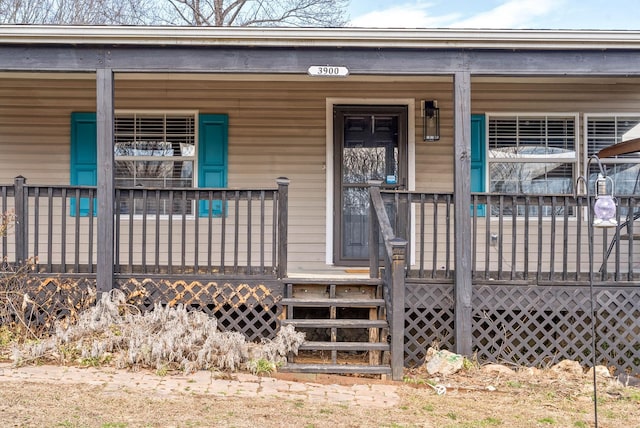 doorway to property with a porch