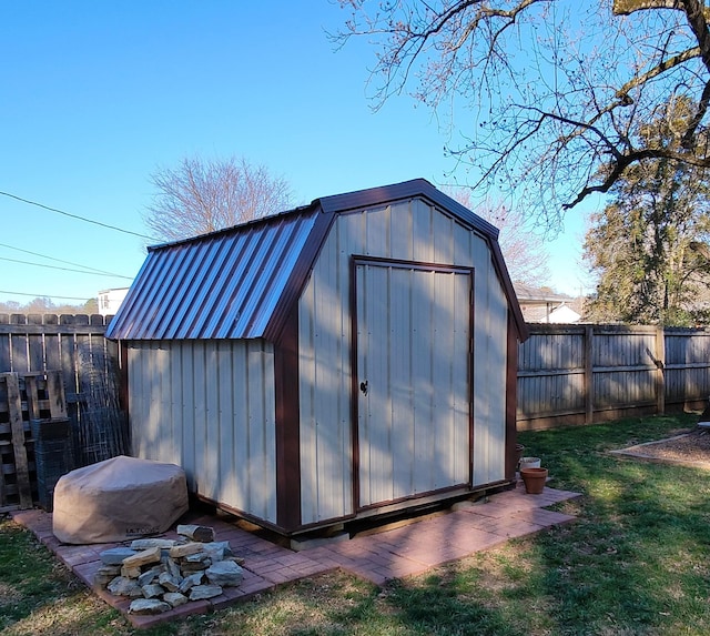 view of shed with a fenced backyard